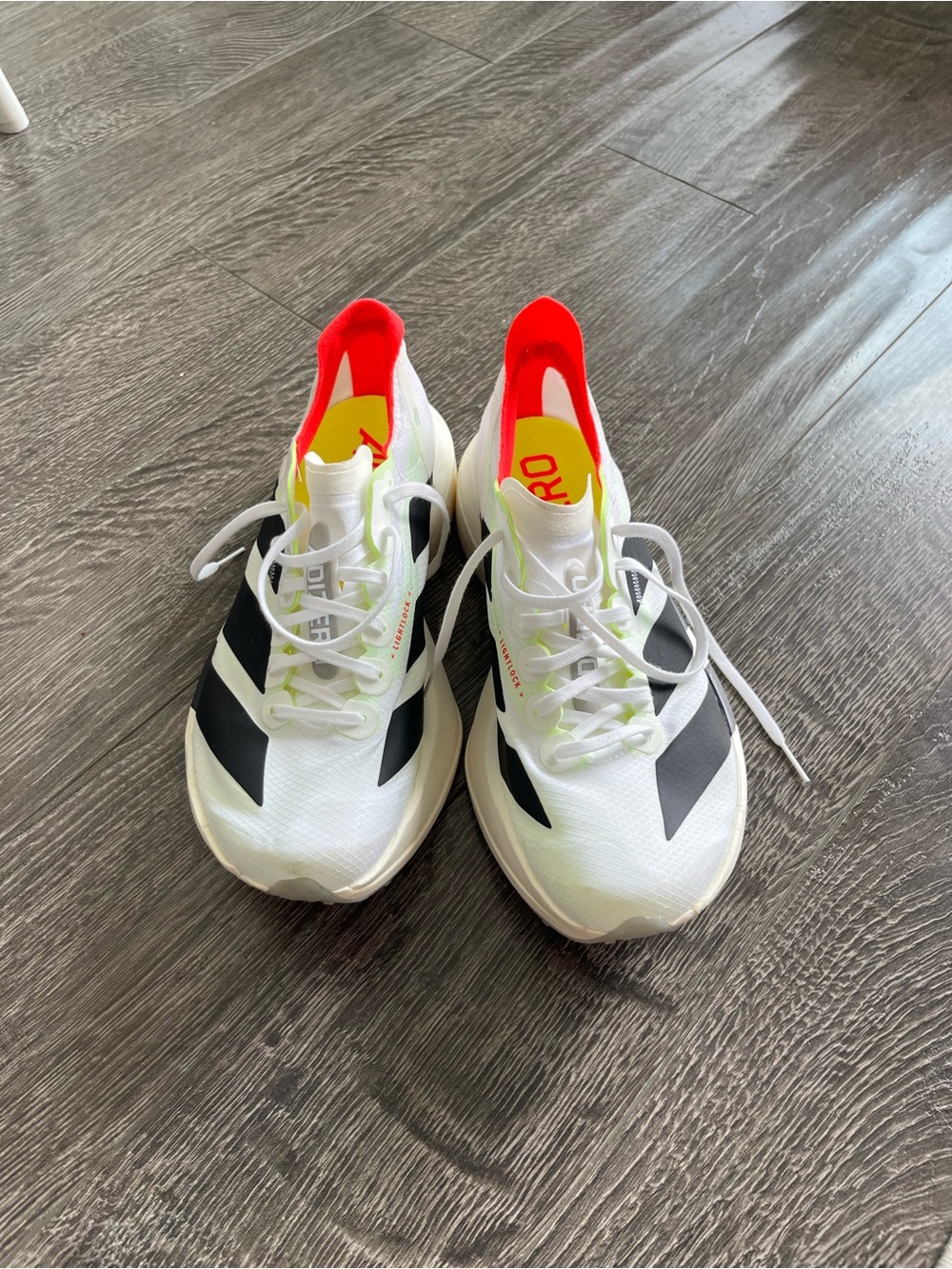 Kids White Athletic Sneakers with Black and Neon Accents